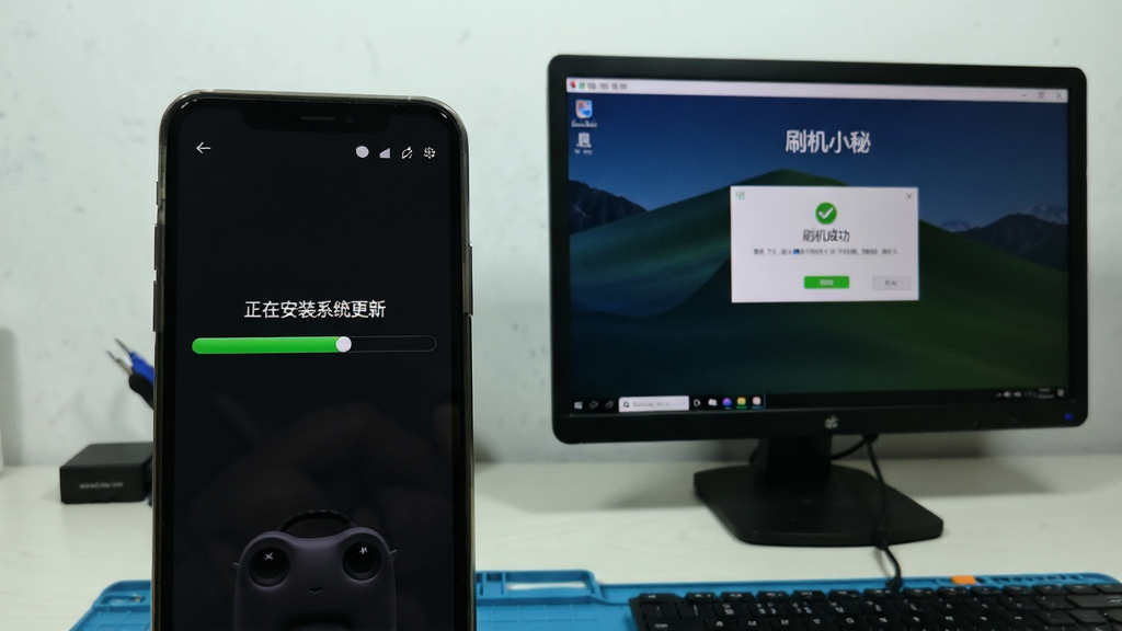 图片主体为一部手机正在刷机过程中的屏幕画面,屏幕上显示进度条与“正在安装系统更新”的字样,电脑屏幕则显示“刷机小秘”的完成界面。布局上,手机在左,电脑在右,背景为简洁的工作台。风格写实,细节上,手机屏幕有绿色进度条,电脑屏幕有“刷机成功”的弹窗,画质清晰,干净,无多余元素。